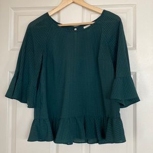 Dark Green sheer blouse with peplum bottom and sleeves. Size medium.
